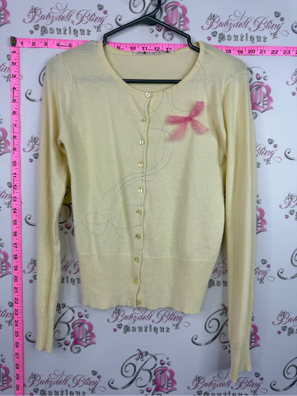 Urban Renewal y2k cardigan bow ribbon Cream Cardigan with Pink Bow Accent